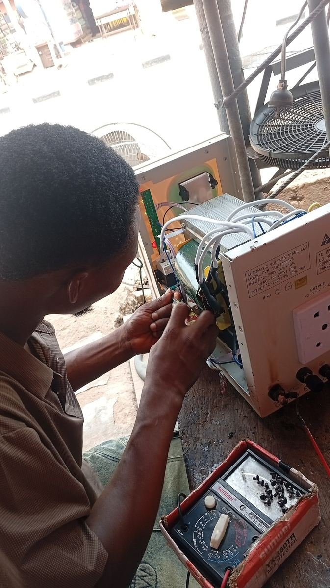 Appliance repair technician at work